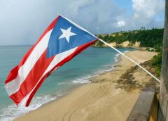 Puerto Rican flag in front of the coastline