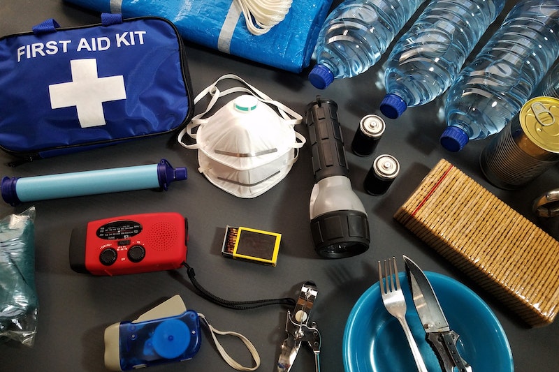 You should keep a first aid kit, batteries, a flashlight, water and some food in your emergency backpack 