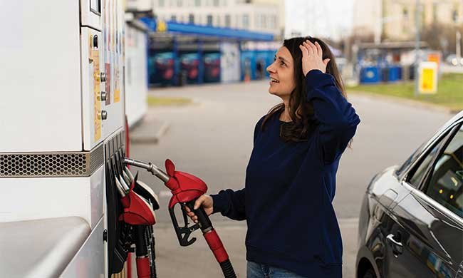 woman at a gas pump